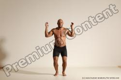 Underwear Gymnastic poses Man Black Muscular Bald Dancing Dynamic poses Academic